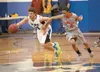 Palmer’s Connor Looney and Wasilla’s Cameron Brown chase a loose ball during Palmer’s win over Wasilla Friday evening at Wasilla High School. ROBERT DeBERRY/Frontiersman.com