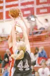 ROBERT DeBERRY/Frontiersman Wasilla junior Kelsey Cottle takes a
shot over Chugiak senior Kasey Kavanaugh during a 39-35 win over
the Chugiak Mustangs on the final day of Doc Larson'€™s Round