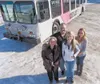Valley Mover executive director Robbie Wuitschick, founder Mokie Tew, finance director Roberta Tew and marketing director Jennifer Tew stand in front of one of their buses at Valley Mover hea