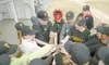 ROBERT DeBERRY/Frontiersman The Pirates all girl little league
team along with head coach Gene Sandone do a cheer before the start
of the second inning during a recent game against the Rockie
