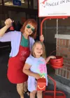 Longtime Salvation Army volunteer/board member Linda Menard-Post with a young donar named Breanna. Courtesy photo./