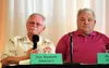 Mat-Su Borough Assembly Member Dan Mayfield, left, addresses the audience as his opponent for his District 5 seat, Clayton 'Mokie' Tew, looks on during a Sept. 22 candidate forum hosted by th