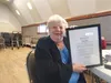 Linda Combs holds up the Citizen of the Year Award. Jacob Mann/Frontiersman