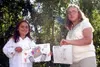 CASEY RESSLER/Frontiersman Agnes Johnson and Lacey Ashlock show
off their winning artwork.