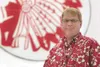 Retiring Wasilla High School Principal Dwight Probasco stands in
front of a Wasilla Warrior mural at the school. Probasco has been
an educator for 30 years, 18 of those as the WHS principal. 