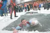 Frontiersman/File photo The annual Polar Plunge raises money for
worthy charities and lowers the body temperature of those stout
enough to attempt the plunge, as in this image from the first
