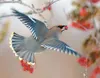 Photo courtesy Laurie Jo Green A Bohemian waxwing is caught
plucking a mountain ash berry from a tree in this photo taken by
photographer Laurie Jo Green. Green’s images will be on display at