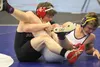 Wasilla's Isaiah Elvsaas keeps a grip on Lathrop's Jordan Opp during the 138-pound final of the Lancer Smith Memorial Saturday at the Menard Sports Center in Wasilla. Elvsaas is a defending s