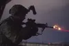 A U.S. Airman assigned to the 3rd Air Support Operations Squadron (ASOS) fires an M4 carbine during night live-fire sustainment training at Joint Base Elmendorf-Richardson, Alaska, Nov. 29, 2