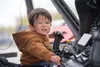 With the seriousness of a combat pilot, Wesley Forster grips the controls of Northern Pioneer's Sikorsky UH60A+ at the gathering at Palmer Airport. J. David McChesney/Frontiersman
