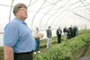 ROBERT DeBERRY/Frontiersman University of Alaska Fairbanks
Assistant Professor Jeff Smeenk talks to state lawmakers,
agriculture officials and high school FFA members inside a high
greenhouse