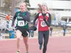 Colony’s Audrey Michaelson, left, and Wasilla’s Peggy Mathis dash for the finish line during the 1,600-meter run at the 2012 Region III Track and Field Championships at Palmer High School. RO