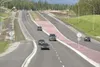 ROBERT DeBERRY/Frontiersman Traffic moves along the new section
of Trunk Road near the roundabout Thursday afternoon.