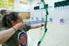 Alaska Air National Guard 1st Lt. Laurel Foster, 176th Force Support Squadron Force Development and Education officer, shoots archery with Service High School Navy Junior ROTC cadets, April 1