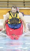 ROBERT DeBERRY/Frontiersman Paul Gray slides off the pool deck
and into the water during a recent basic kayaking class at the
Wasilla Pool.