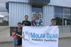 Chris and Brittany Rosenvall stand in front of the upcoming location of Molar Bear Pediatric Dentistry with their four children, Clark, Issac, Sage and Clay. Jacob Mann/Frontiersman