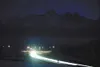 The headlights of Valley commuters line the road at the
intersection of the Glenn and Parks highways Monday afternoon. The
commuter route to Anchorage will be lined with light poles south of

