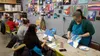Paint Nights With Sara instructor Laurie Lashlee walks participants step by step to paint a wintery scene featuring the Aurora Borealis. Photos by Jacob Mann/Frontiersman