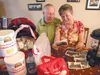 Jim and Debby Brown display some of their emergency supplies as they look over family photos of the 1964 Earthquake, reminiscing about their experiences during the quake and the importance of