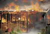 Flames engulf a home on Winding Brook Loop July 6. The fire, which was called in around 4 p.m, brought a response from Palmer and Central Mat-Su Fire Departments and took a little over two ho