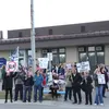 A group of people waved signs and flags prior to a Palmer City Council meeting Tuesday which was initially slated to include a presentation by the Moms for Social Justice group. photos by Tim
