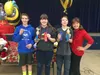 From left, second runner-up Trevor Kroening, first runner-up Dayton Gatewood and school champion Kasen Callison pose with teacher Linda Klapperich following the Palmer Junior Middle School Ge