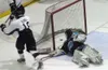 Kenai River's Tony McDonald celebrates after getting the puck
past Alaska goalie Nathan Corey in the second period of Kenai
River's 7-2 win at the Curtis C. Menard II Memorial Ice Arena in
Wa