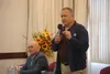 State Sen. Mike Shower, standing, speaks at a Greater Wasilla Chamber of Commerce candidate forum on Oct. 18. Seated next to him is his challenger, fellow Republican Doug Massie. Both are Rep