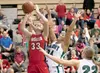 Wasilla senior forward Kyla Dinkel shoots for two points as Colony’s Jennifer Solano attempts to block the shot during the Warriors 56-29 win Friday at Colony High School. ROBERT DeBERRY/Fron