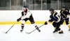 Houston's Daniel Matveev moves the puck away from the defense during a win over Tri Valley. Bruce Eggleston/matsusports.net