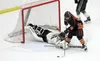 Colony goaltender Joey Diltz reaches out to stop a shot by West Anchorage's Sullivan Mack and make a save during a 4-0 loss to West in the first round of the ASAA/First National Bank 4A State