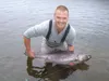 Jess Oswald holds his first king salmon, caught at Montana Creek. Courtesy Jehnifer Ehmann