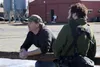 Point Mackenzie Correctional Farm technician Adam Boyd, left, talks to media during an April 1 tour of the facility. CAITLIN SKVORC/Frontiersman.com