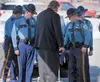 Members of the Alaska State Troopers escort the body of Trooper Tage Toll into Alaskan Heritage Memorial Chapel Wednesday afternoon. Toll was killed Saturday when the Department of Public Saf