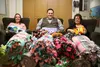 Set Free Alaska counselor Shannon Harris, left, CEO Philip Licht, and Children's Place Executive Director Paula Jones smile for a photo at The Children's Place in Wasilla on Tuesday. Set Free