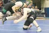 Wasilla senior Casey Katchinska takes a hit to the face as he
tries to take down Colony's Tim Edwards during the semifinals at
the Lancer Smith Memorial Wrestling Tournament Friday at Palmer

