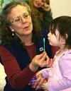 Barbara Stanfill, a teacher with the Infant Learning Program at
MSSCA, gets a child to blow bubbles during a weekly playgroup at
the MSSCA offices. CASEY RESSLER/Frontiersman