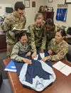 Air University Squadron Officer School students Capt. James Flores-Lombay, Capt. Jessica Sunkamaneevongse, Capt. Kristen Ricker, Capt. Tanisha Bramwell-Boose and Air Force Office of Special I