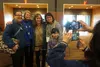 Lisa Murkowski poses for photos on Saturday at the close of the Alaska Federation of Natives convention with Joe Nelson and Ana Hoffman, co-chairs of the organization, and AFN Executive Vice 
