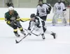 ROBERT DeBERRY/Frontiersman Colony senior forward Trevor Naylor
takes control of the puck during Thursday’s game against the
Service Cougars during the Curtis C. Menard II Memorial Hockey
Tou