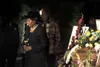 Dr. Kenneth Stephen Burnley's sister-in-law Mary Jackson-Gordon
walks away from the casket during the flower ceremony Friday at the
celebration of life for Dr. Burnley who died suddenly from
