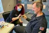CERT member Ron Brooks volunteered to be a "victim survivor" for an earthquake scenario as part of the practical application training. He is being moulaged by Keisa "Red" Cott as a victim str
