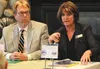 Mat-Su Borough Schools Superintendent Monica Goyette, right, addresses a question from the audience as Mat-Su Borough Manager John Moosey looks on during Tuesday's Greater Wasilla Chamber of 