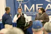 Alaska Live Steamers presents MEA Charitable Board chairman David Dahms with a thank you gift for the $7,000 grant from Operation RoundUp to construct a protective fence around their new site