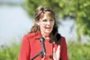 ROBERT DeBERRY/Frontiersman Gov. Sarah Palin during a Friday
announcement from her Lake Lucille home that she will step down
from office.