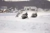 A trio of racers round the first corner during an ice race on
Big Lake recently. Valley based Alaska Ice Racing's biggest event,
a 500 mile race, is scheduled for March 13. (ROBERT
DeBERRY/Fr
