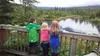 Mason Rhude, 6, Emma Cooper, 4, and Elizabeth Cooper, 7, peer off the viewing deck at the Eagle River Nature Center. MELINDA MUNSON/For The Eagle
