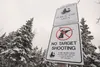 A ‘no target shooting’ sign shows evidence of target practice near the Knik River Public Use Area trail ead parking lot off Sullivan Road in the Butte. The Mat-Su Borough Assembly adopted the