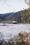 The Luch house rests on a gravel bar in the middle of the Matanuska River Friday afternoon. The Matanuska has started eating into a relatively densely populated area built on soft soils, putt