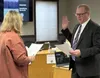Mark Schmidt was sworn into office as the newest Wasilla City Councilmember by city clerk Jamie Newman. Katie Stavick/Frontiersman